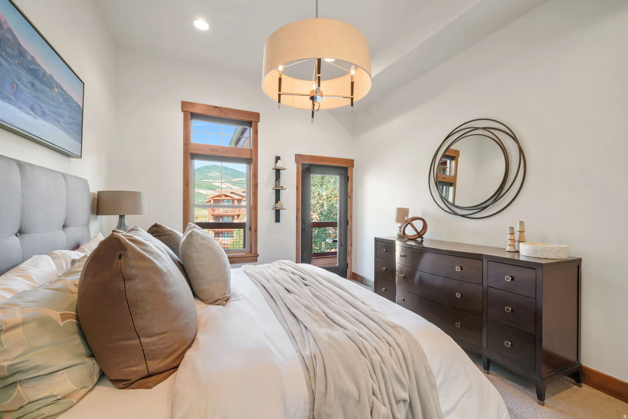 Bedroom featuring a vaulted ceiling and a drum pendant light fixture