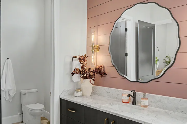 Vanity featuring a marble-finish countertop with an integrated rectangular sink