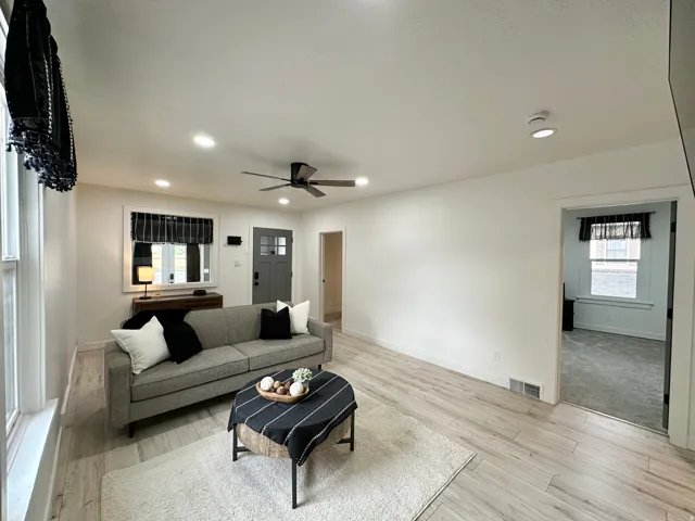 Bright living area with light wood-finish flooring