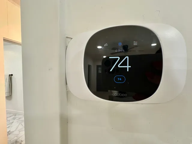 ecobee smart thermostat featuring a digital display