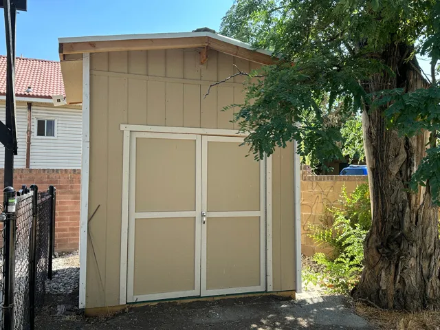 Freestanding shed with double entry doors and a single-pitch roof