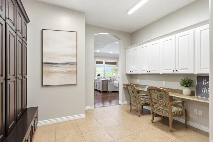 Built-in white cabinetry with granite-style countertops