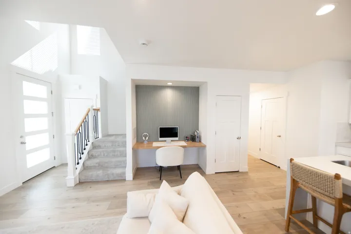 Integrated office nook featuring recessed lighting and vertical panel accent wall