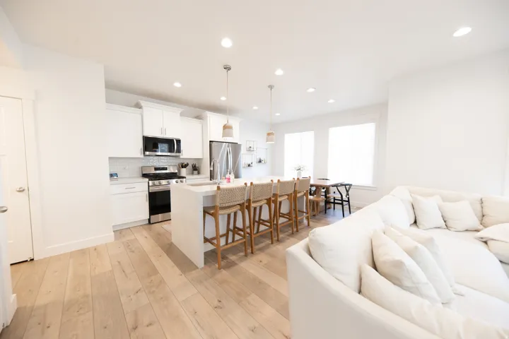 Open-concept living area featuring light wood-finish flooring