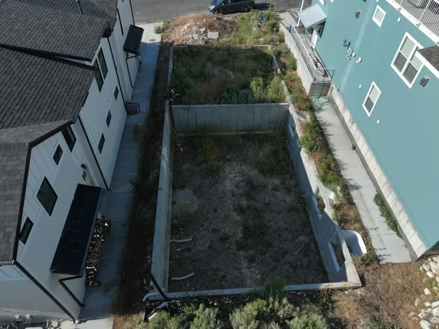 Excavated lot featuring concrete retaining walls