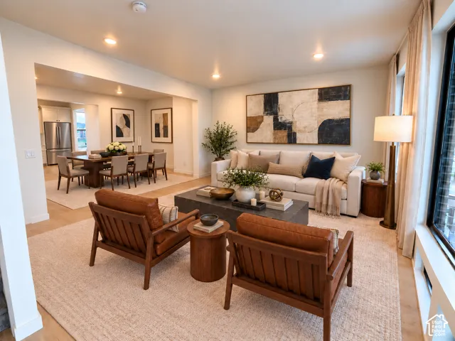 Recessed lighting, wood-finish flooring, and expansive windows