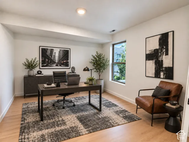 Recessed ceiling lighting, a single window, wood-finish flooring, and crisp white walls
