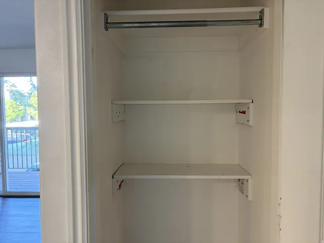 Built-in closet shelving with a hanging rod