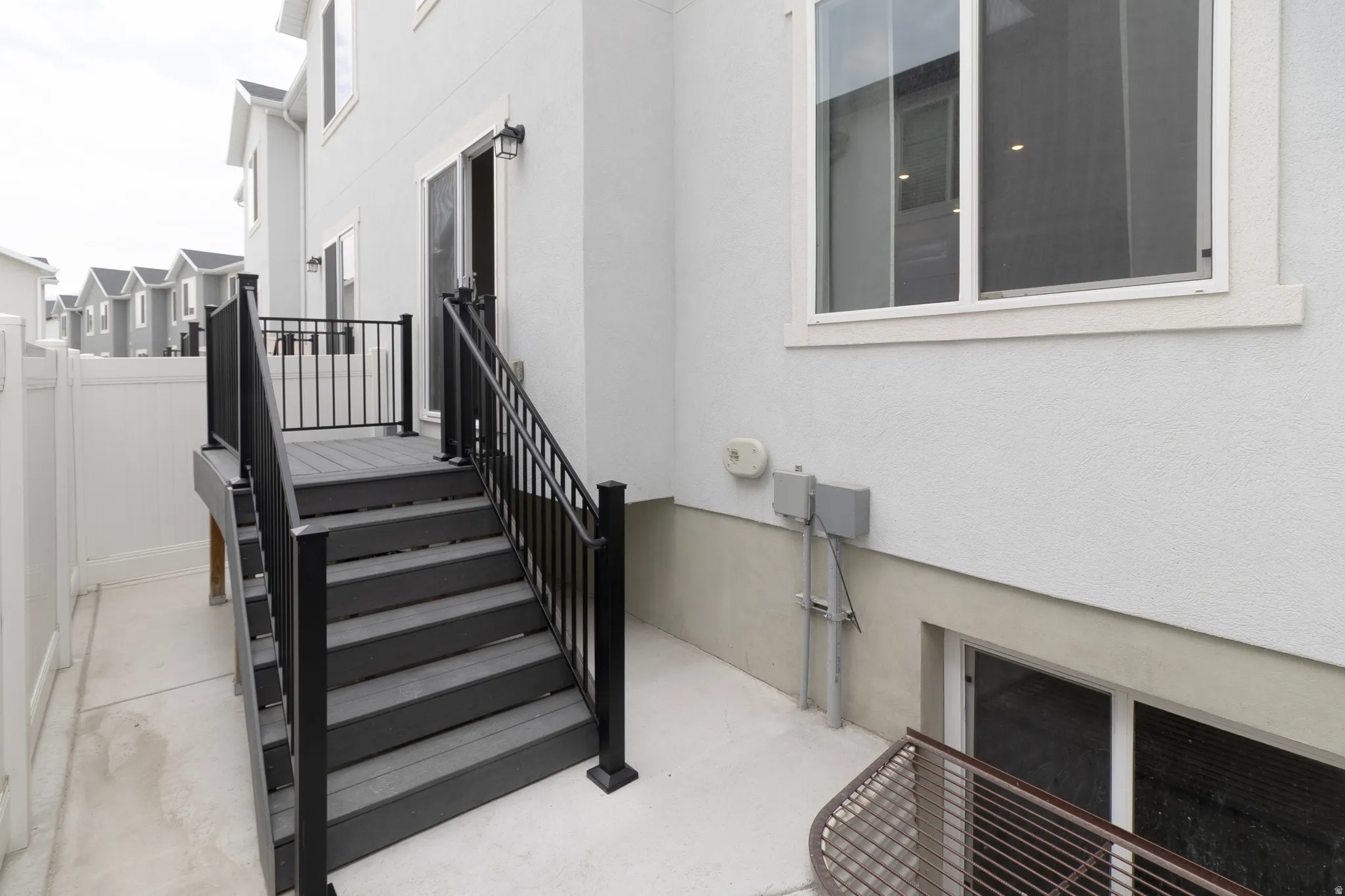 Exterior staircase with black railings
