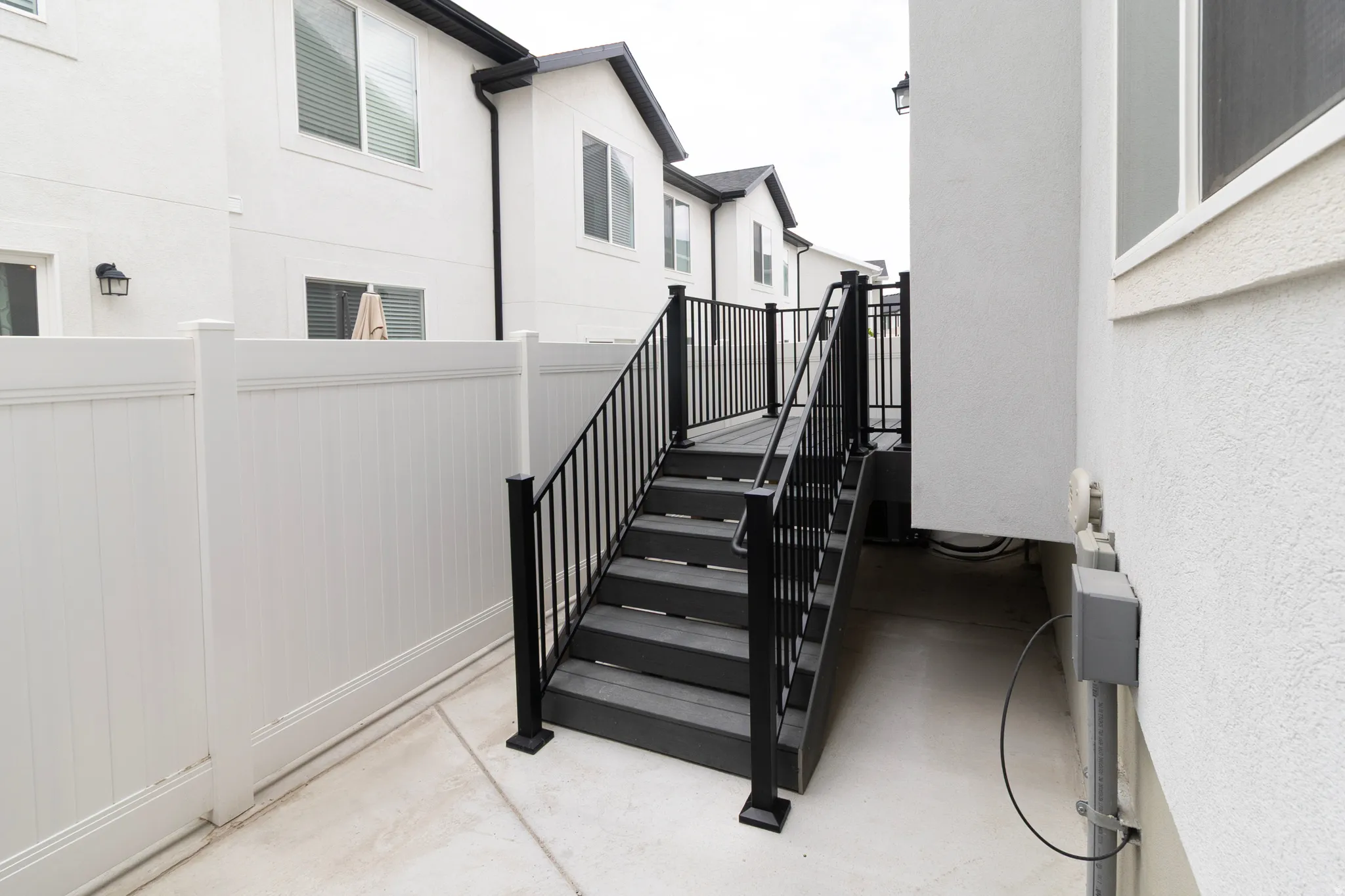 Exterior staircase with black railings
