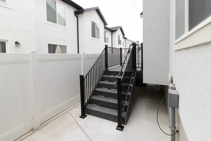 Exterior staircase with black railings