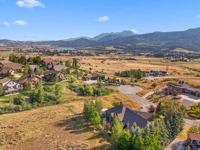 Expansive property showcasing residential structures amidst natural terrain