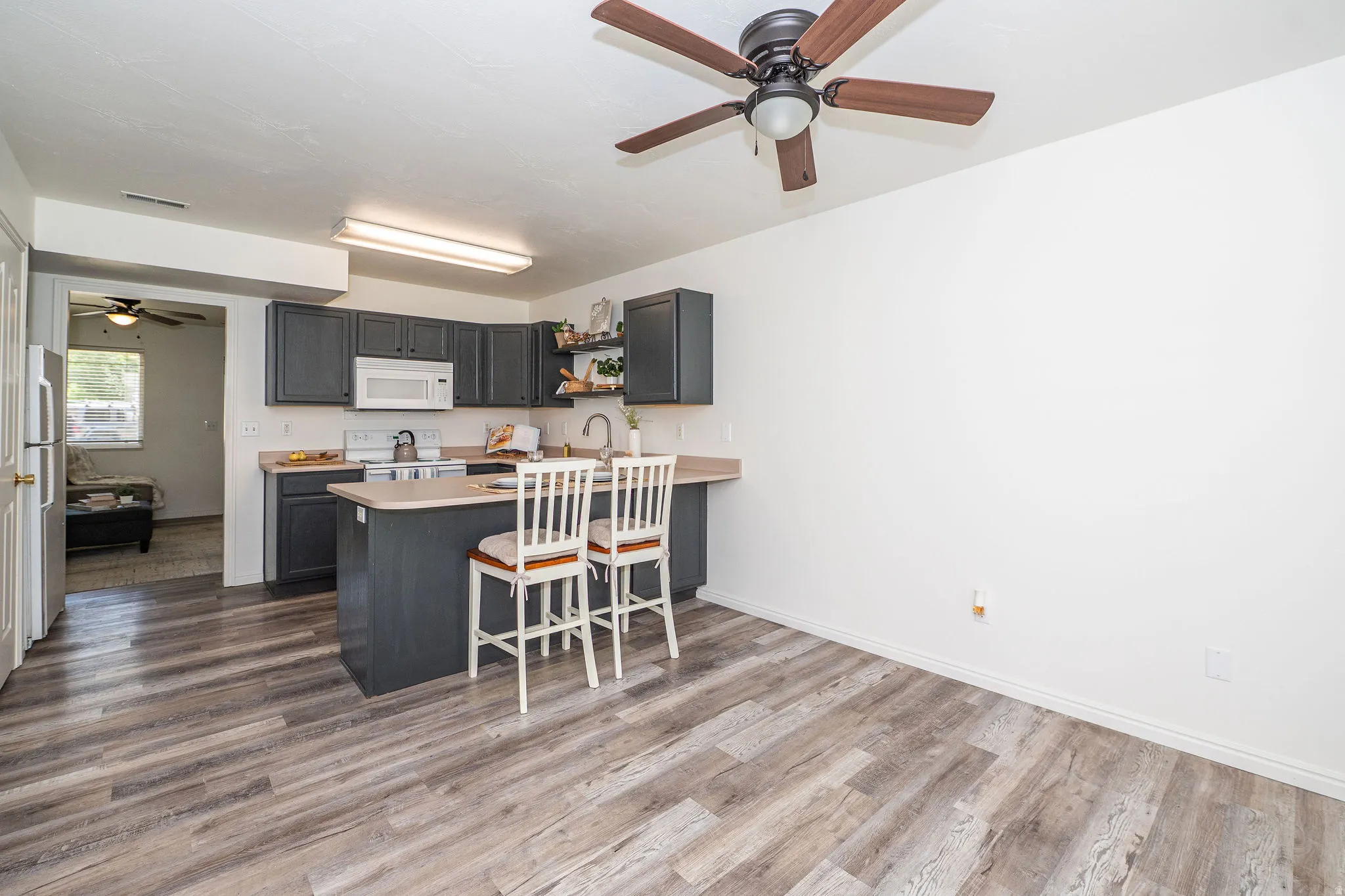 Kitchen & dining area showing entry into living room.