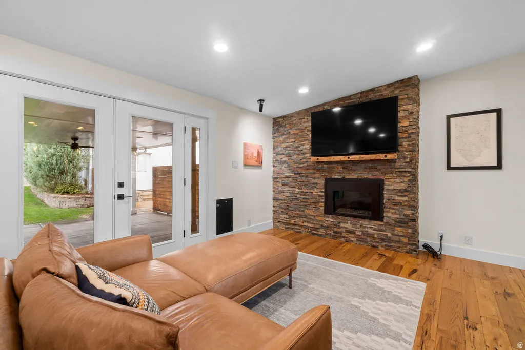 Stacked stone fireplace with a built-in gas insert and a wood mantel