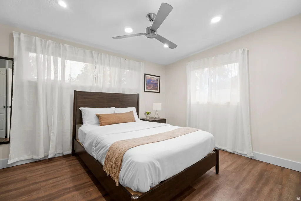 Bedroom featuring wood-finish flooring, recessed lighting, and a contemporary ceiling fan