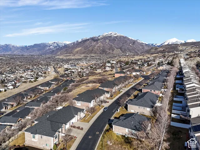 Expansive mountain range backdrop framing a residential neighborhood