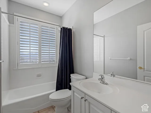 Main Full bathroom featuring a white tub/shower combination with a privacy window