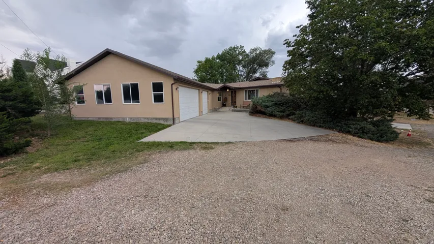 Upstairs entrance and 3-car garage