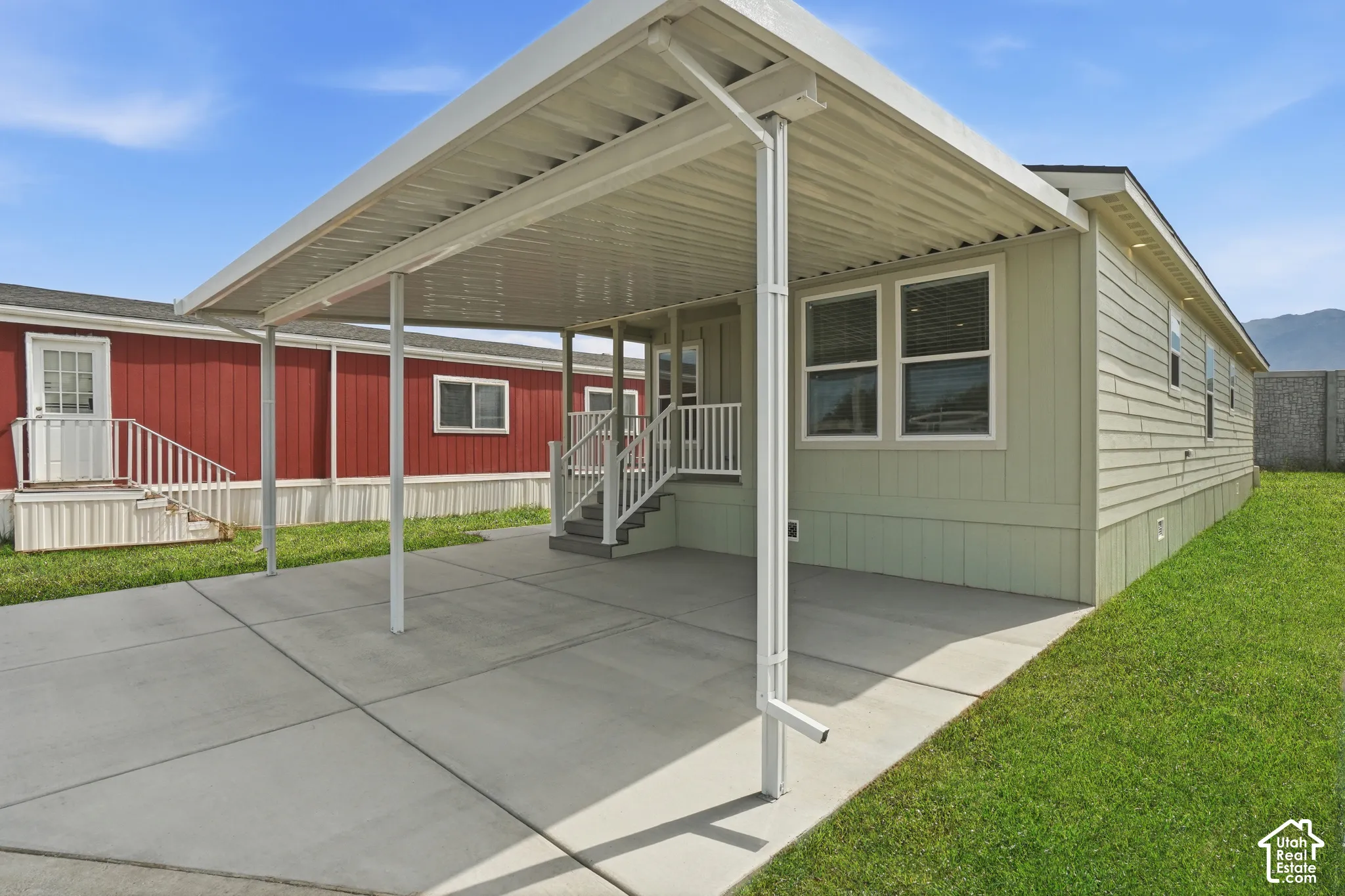 Expansive concrete carport providing covered parking