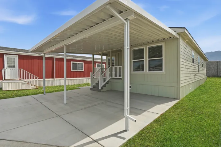 Expansive concrete carport providing covered parking