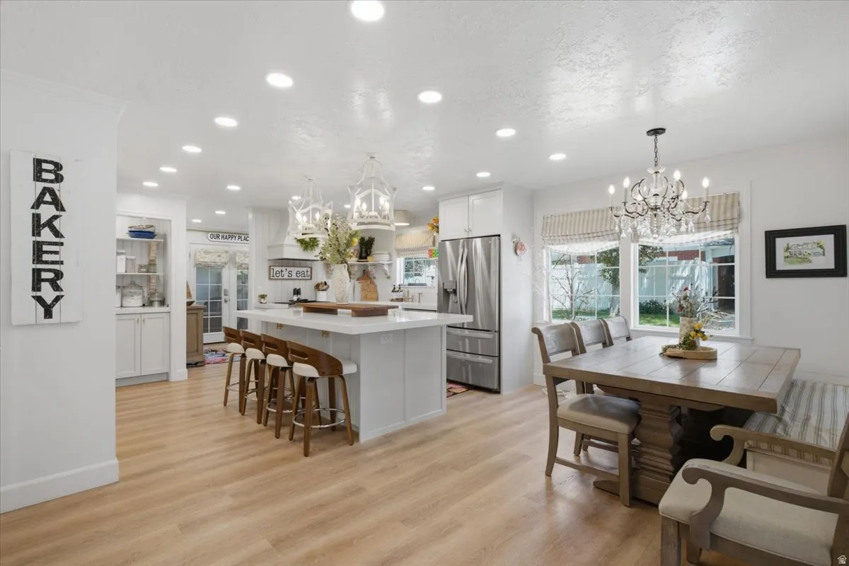 Open-concept living space with light wood-finish flooring