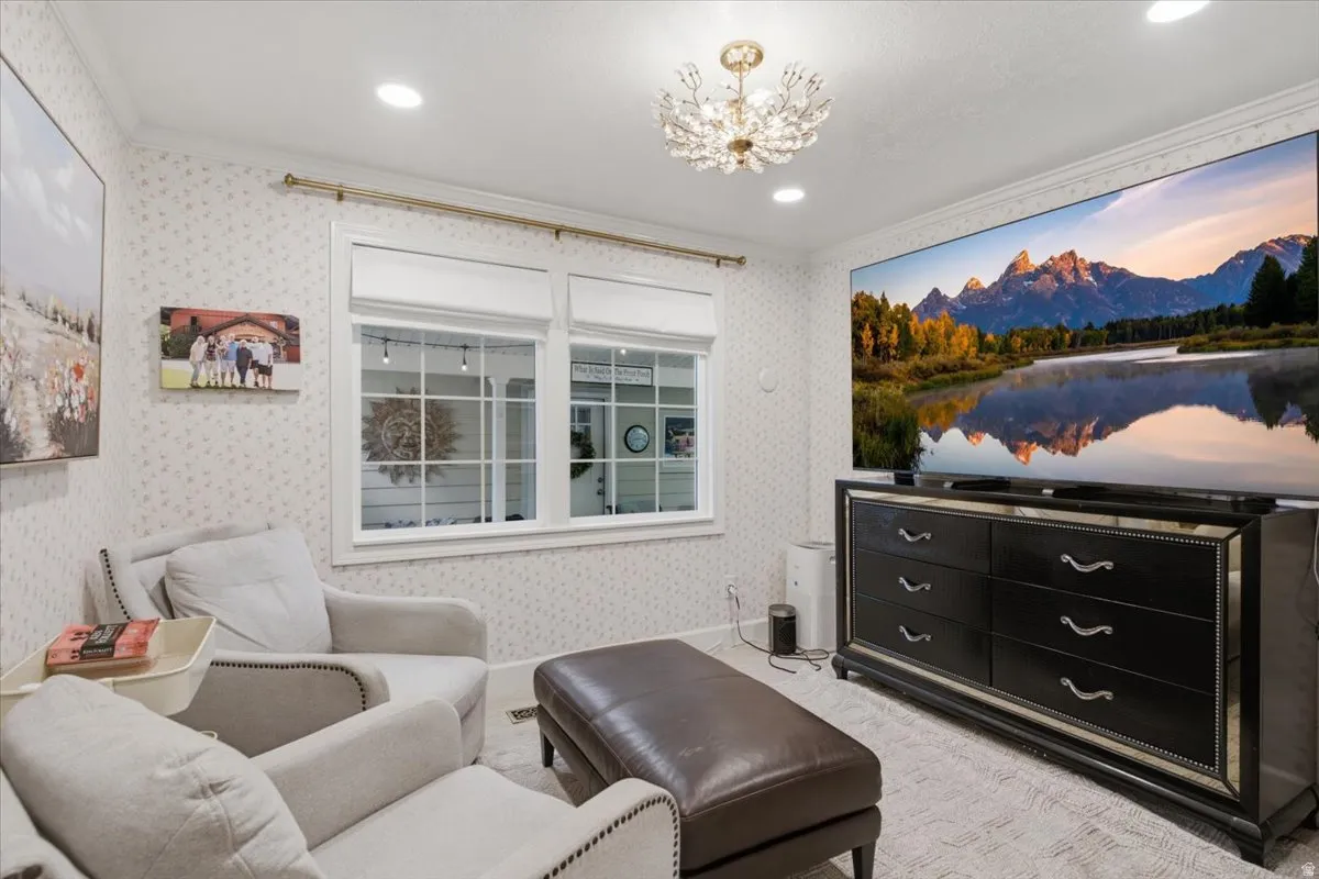 Bright room featuring white trim windows, recessed lighting, and a decorative ceiling fixture