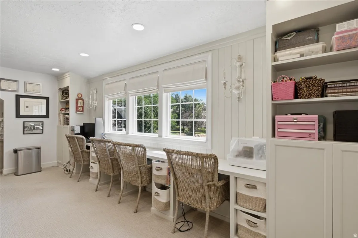 Bright room featuring multiple built-in workstations with individual storage