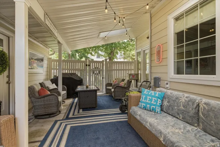 Covered patio with a skylight and concrete flooring