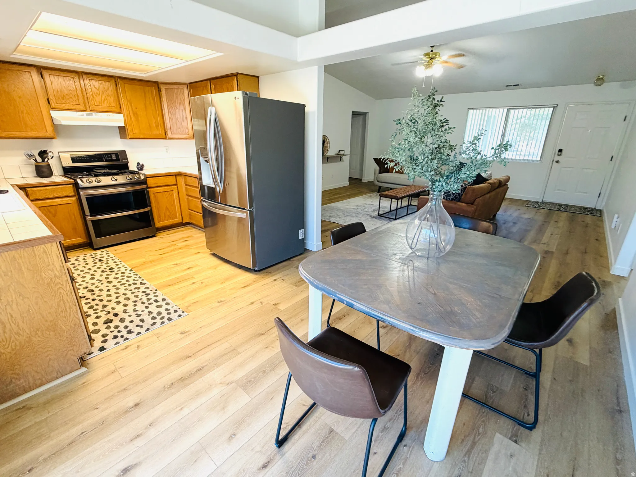 Open-concept living space with wood-finish flooring throughout