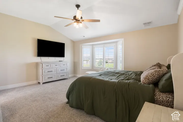 Bedroom featuring a vaulted ceiling and a ceiling fan