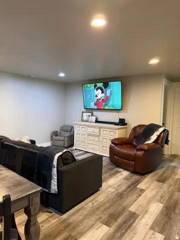 Living room/ great room, flows from kitchen area. Couch and TV included.