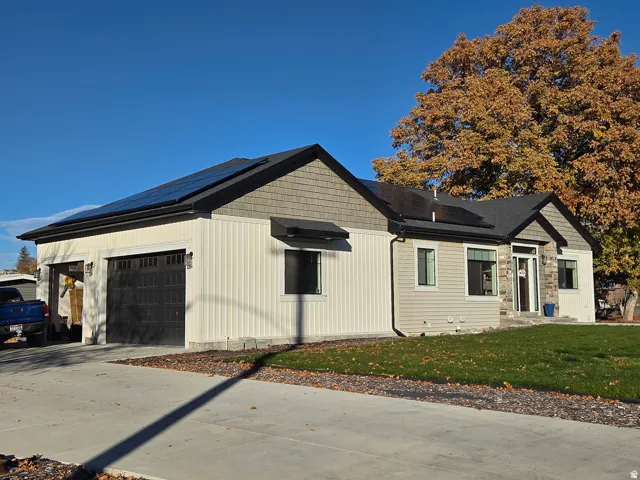 Outside view of home. Garage on left belongs to the rental unit. Entrance to rental is behind the home.
