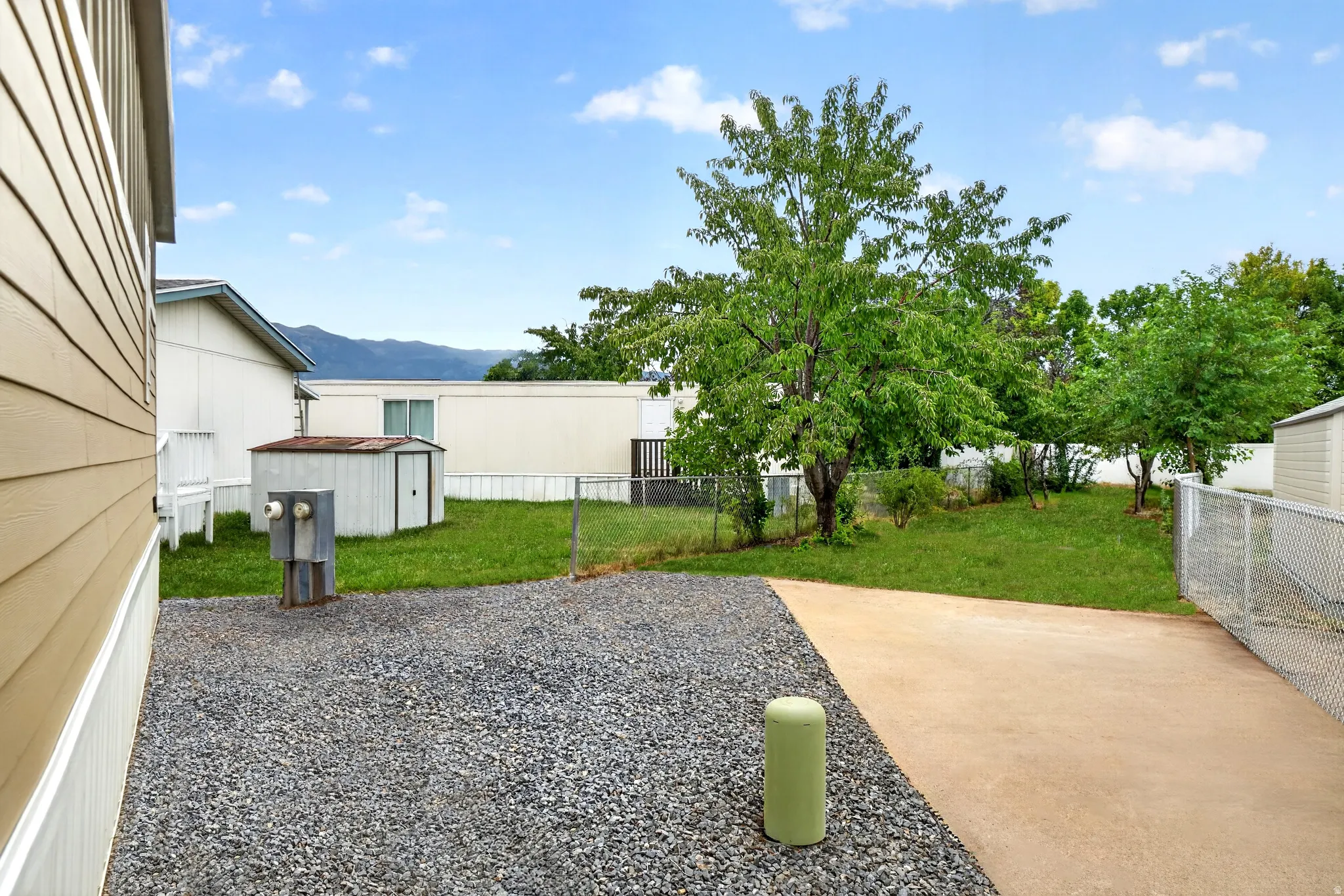 Expansive gravel and concrete driveway