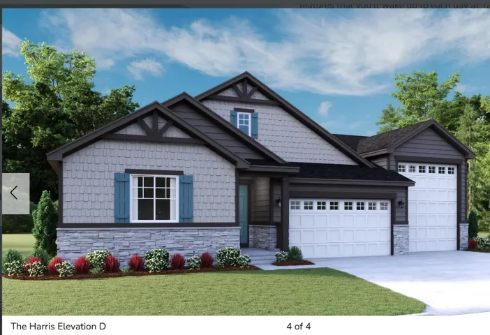 Craftsman-style exterior featuring gray shake siding and stone accents