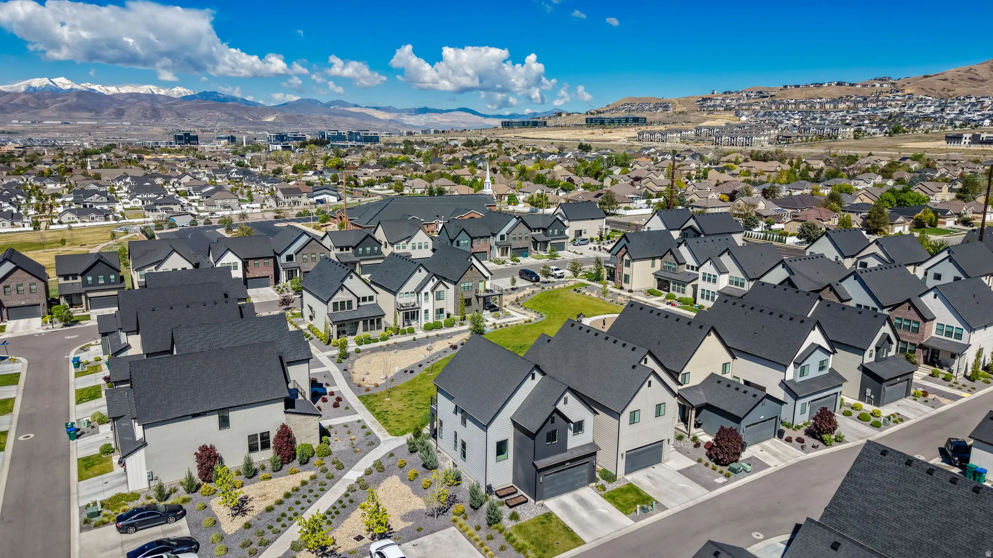 Aerial overview showcasing a contemporary residential development with multiple detached homes