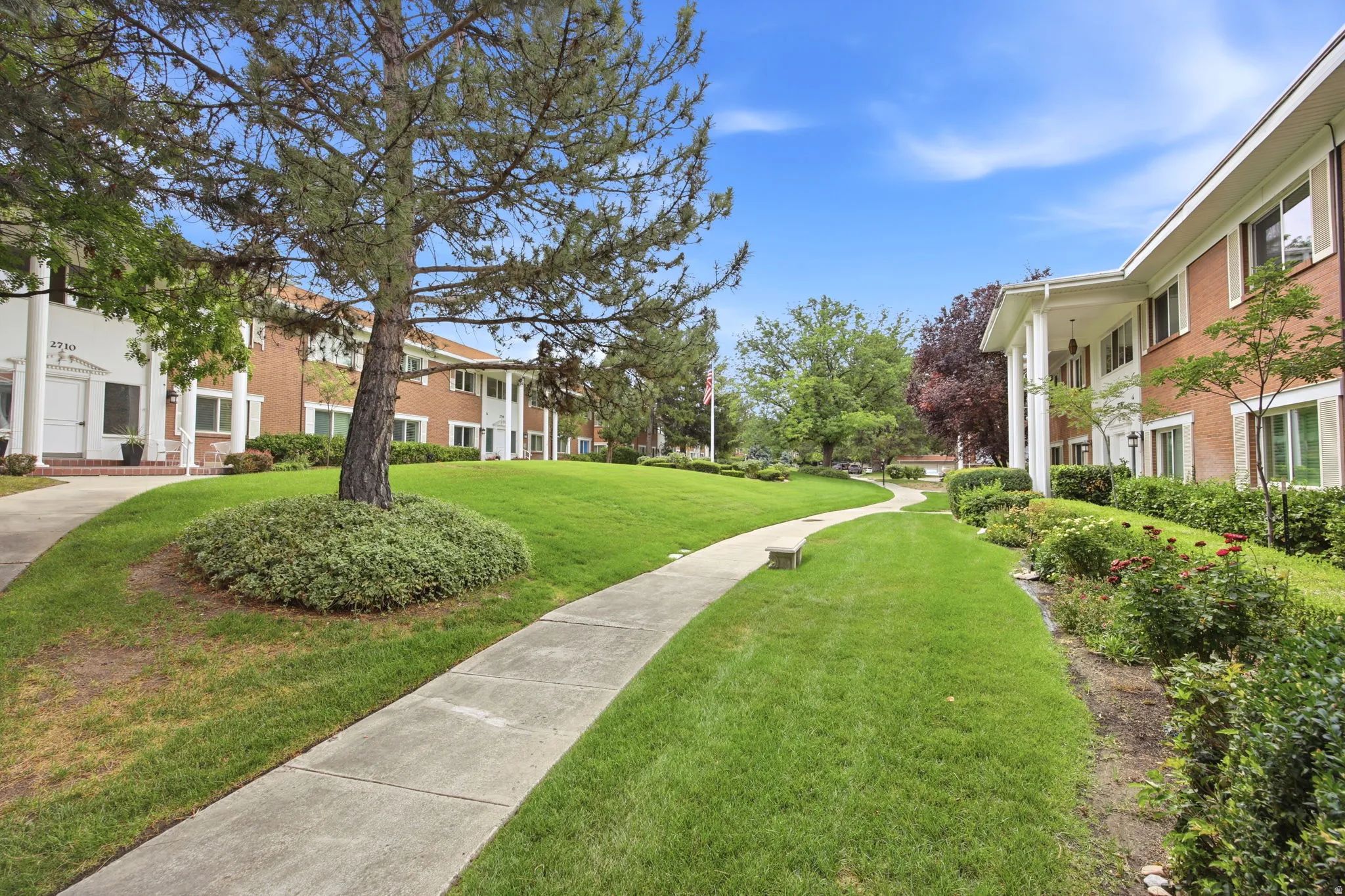 Expansive green spaces with concrete pathways