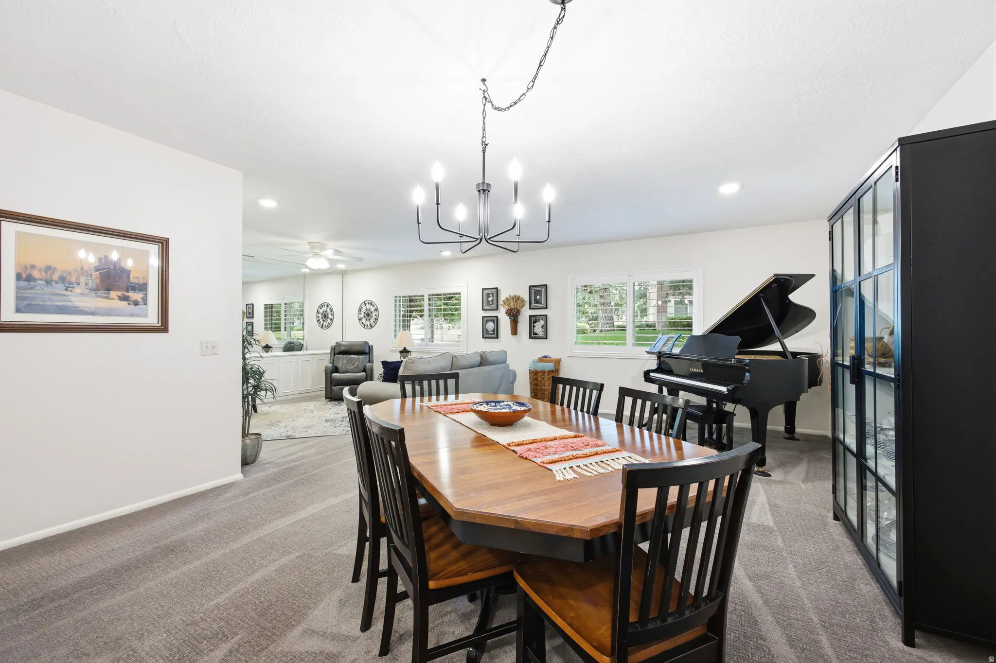 Open-concept living area with a dark wood-finish dining table and six chairs