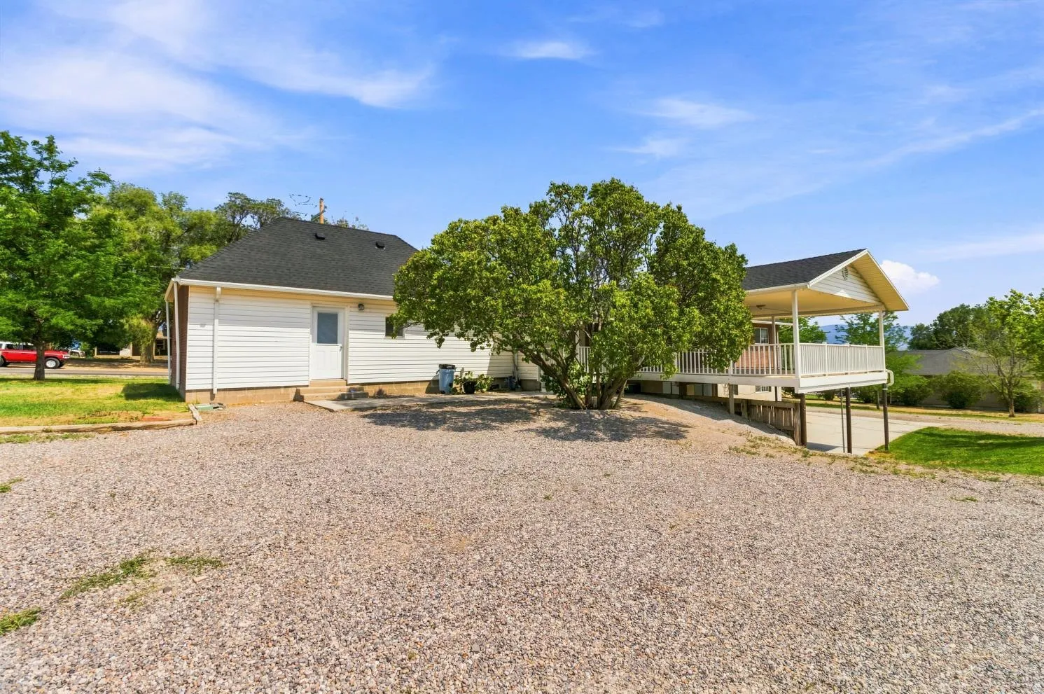 Expansive gravel driveway providing ample parking