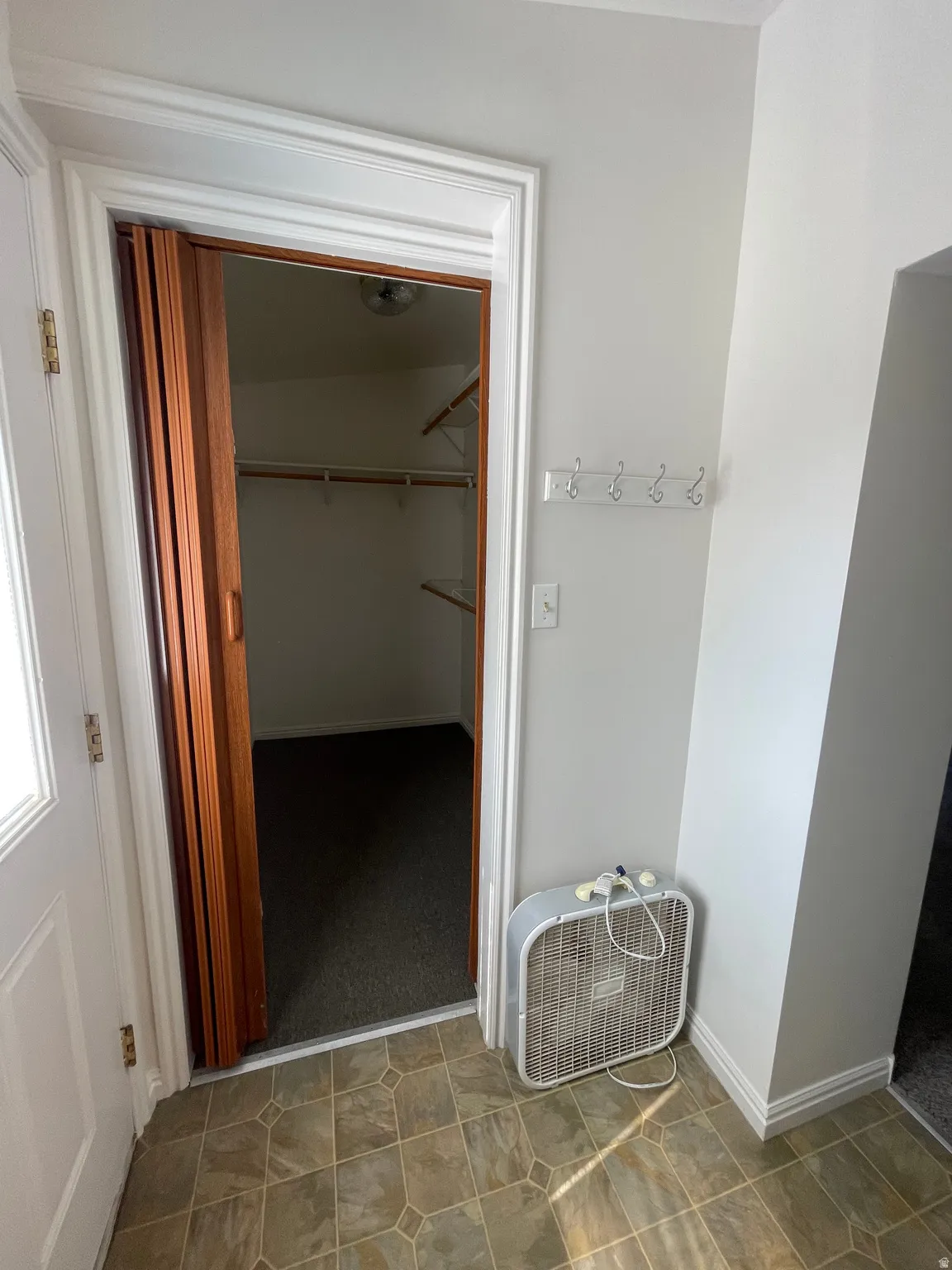 Closet storage with bi-fold doors and interior shelving