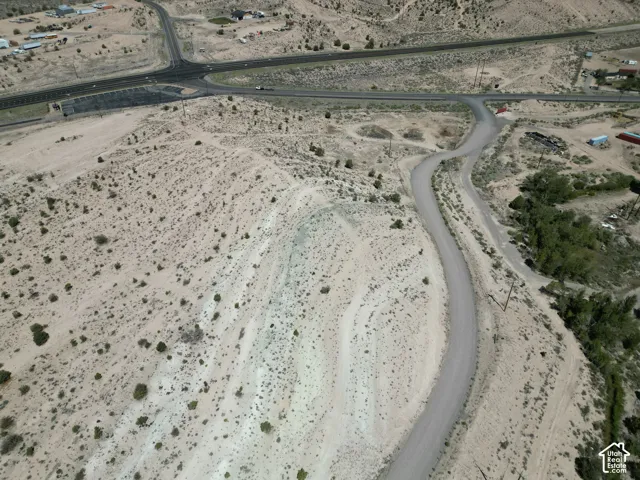 Expansive desert landscape with scattered low-lying vegetation