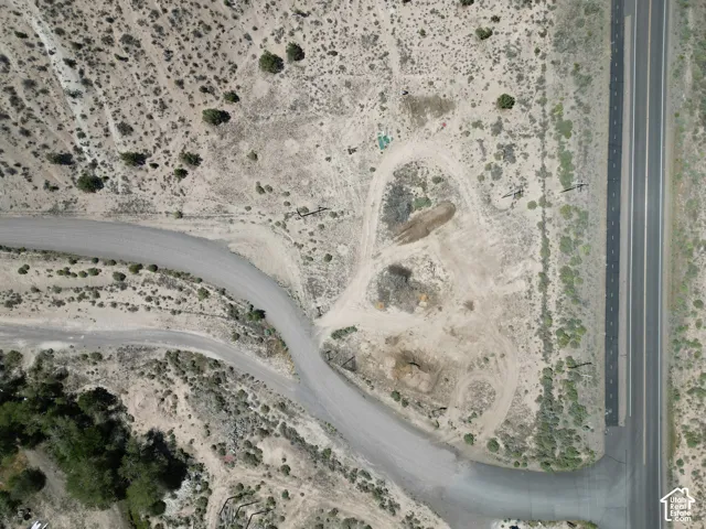Expansive undeveloped parcel featuring direct paved road frontage