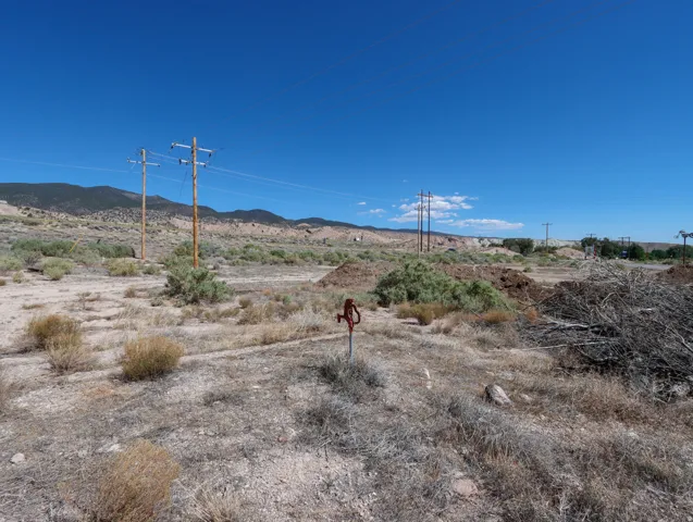 Expansive natural landscape with arid vegetation and distant mountains