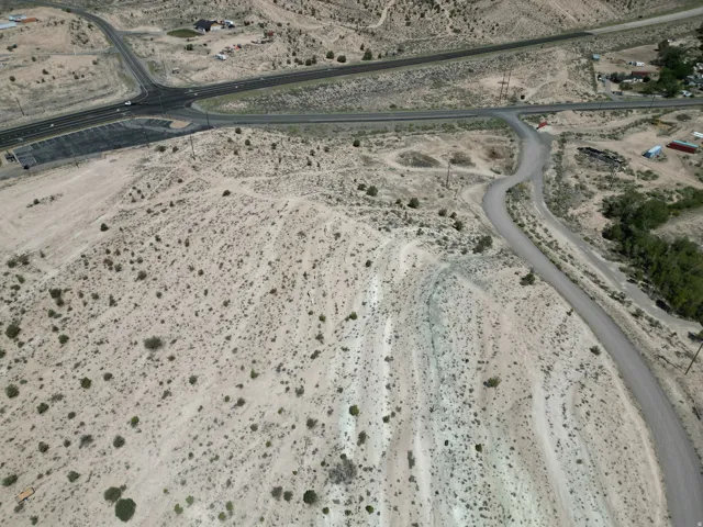 Expansive desert landscape featuring natural terrain and sparse vegetation