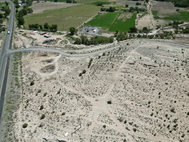 Expansive desert landscape featuring natural terrain and sparse vegetation