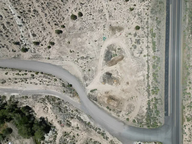 Expansive undeveloped parcel featuring direct paved road frontage