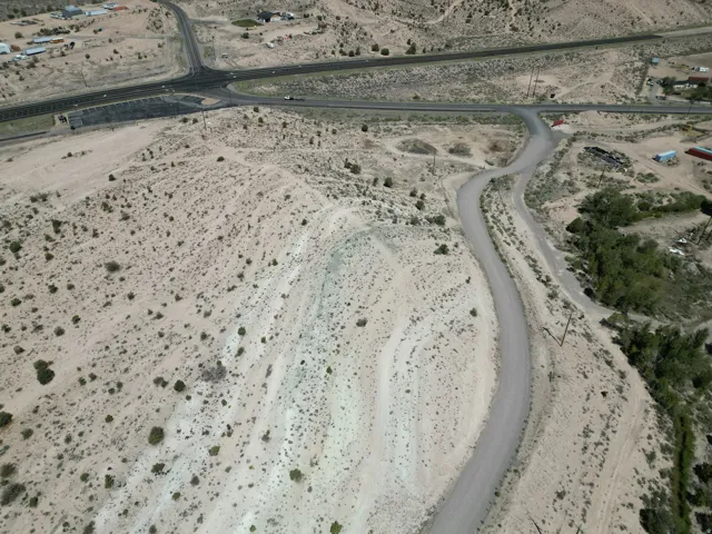 Expansive desert landscape with scattered low-lying vegetation