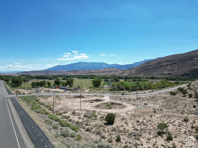 Expansive vacant land offering panoramic mountain vistas and established irrigation infrastructure