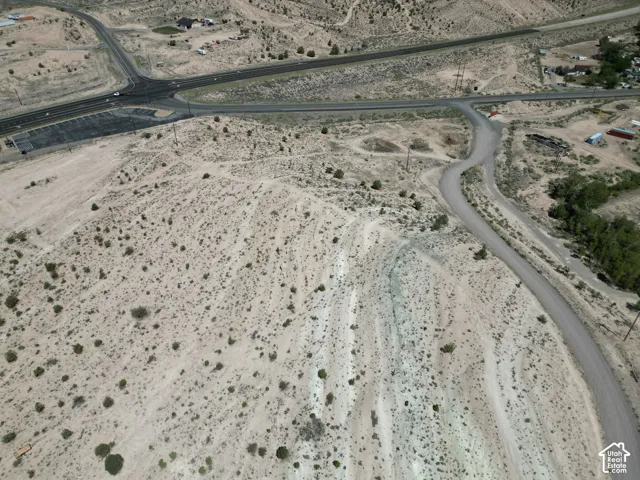 Expansive desert landscape featuring natural terrain and sparse vegetation