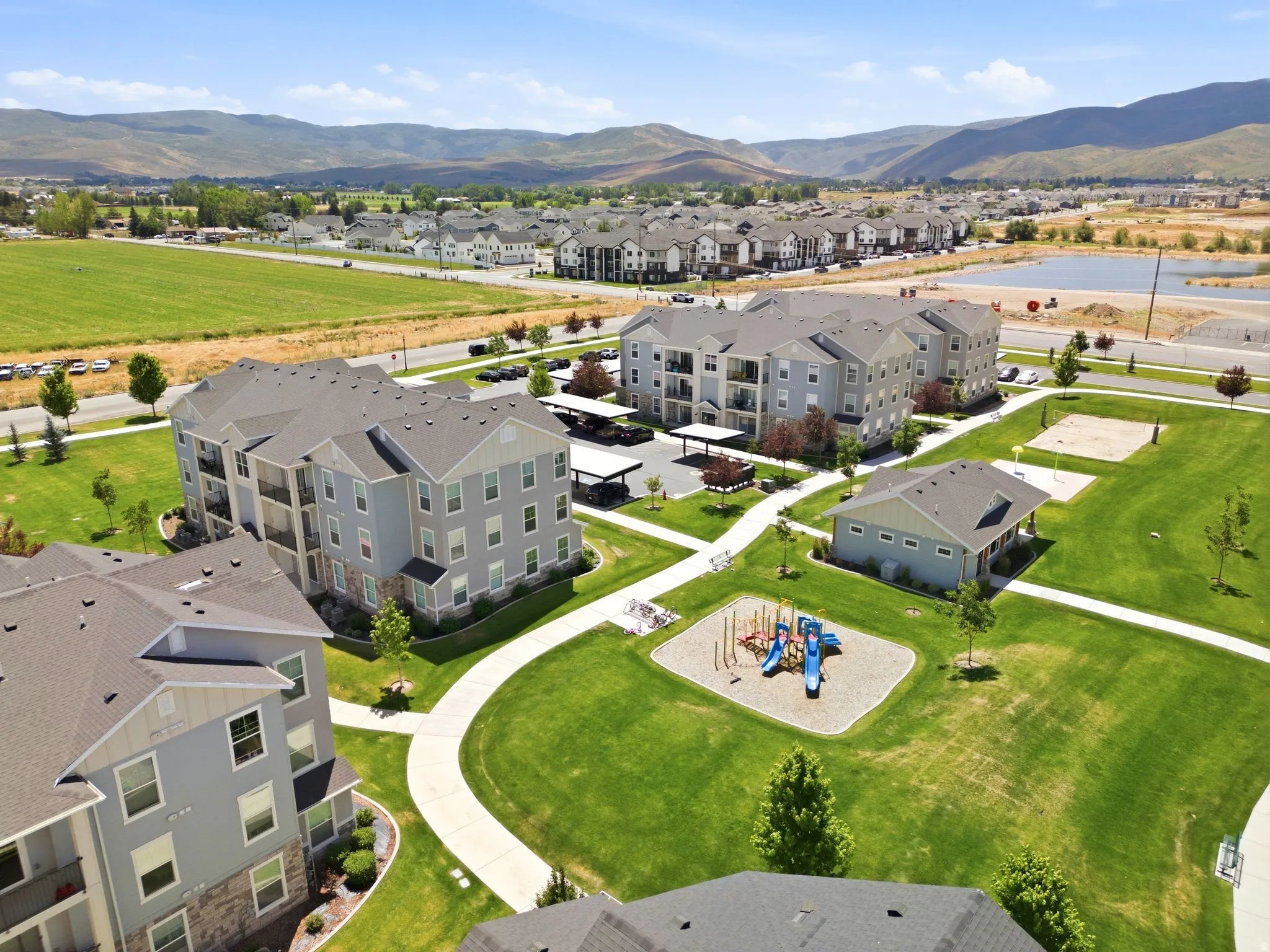 Contemporary multi-story buildings featuring neutral-toned siding and private balconies