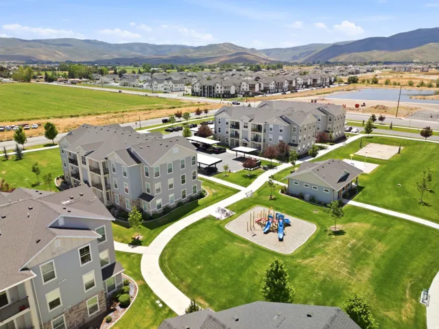 Contemporary multi-story buildings featuring neutral-toned siding and private balconies